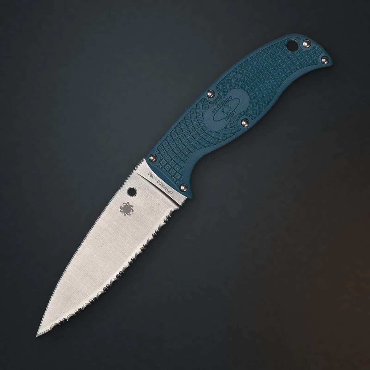Spyderco Enuff 2 – Blue FRN, K390, Fully Serrated on a charcoal studio backdrop — image 1 of 3